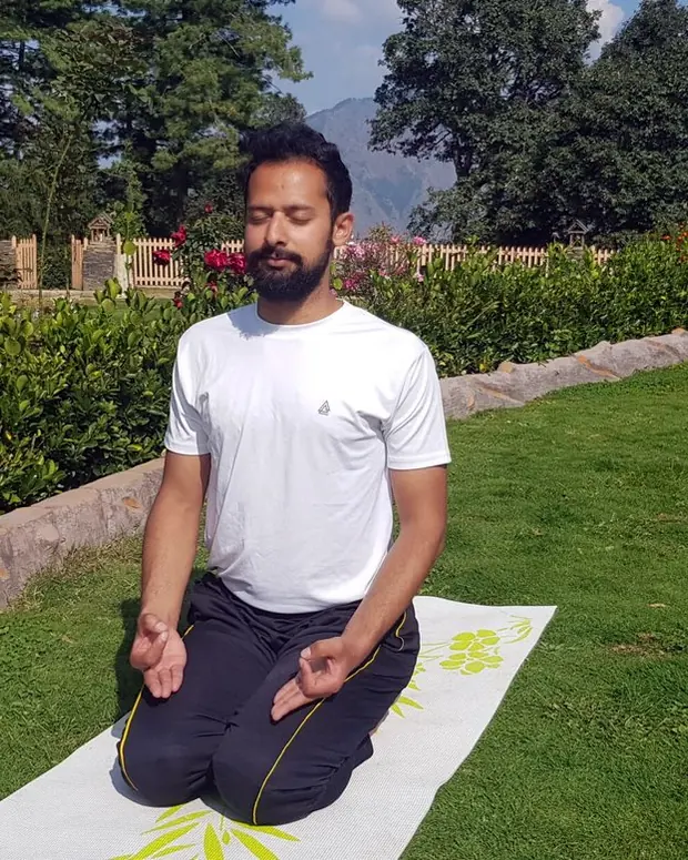 An Utkrisht Yoga coach practising outdoors in the Himachal hills